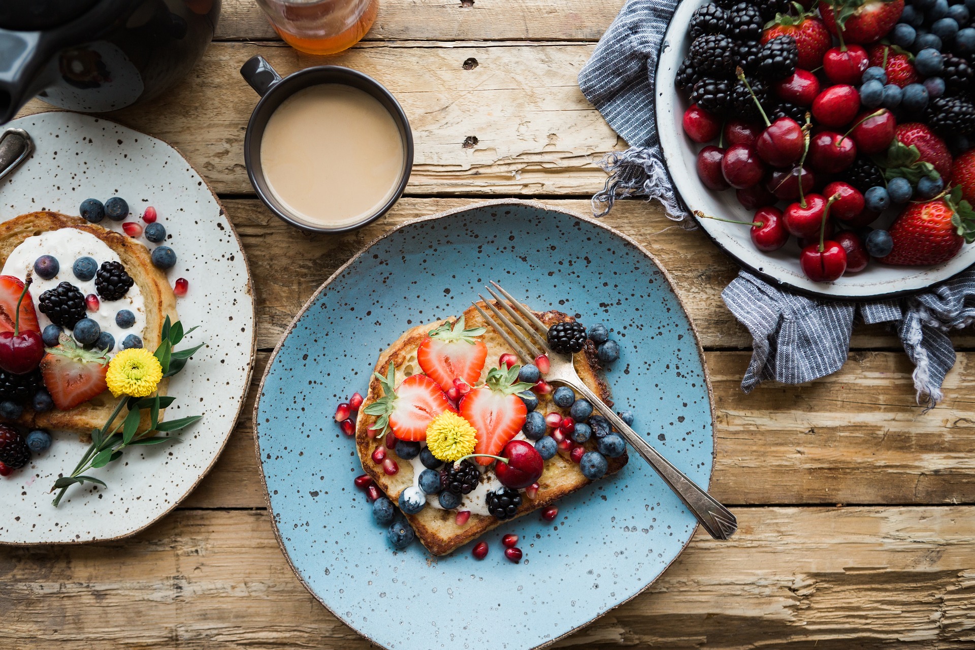 Toast with berries and a cup of coffee.